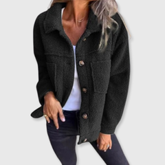 Black sherpa-style jacket with button front, spread collar, and side pockets.