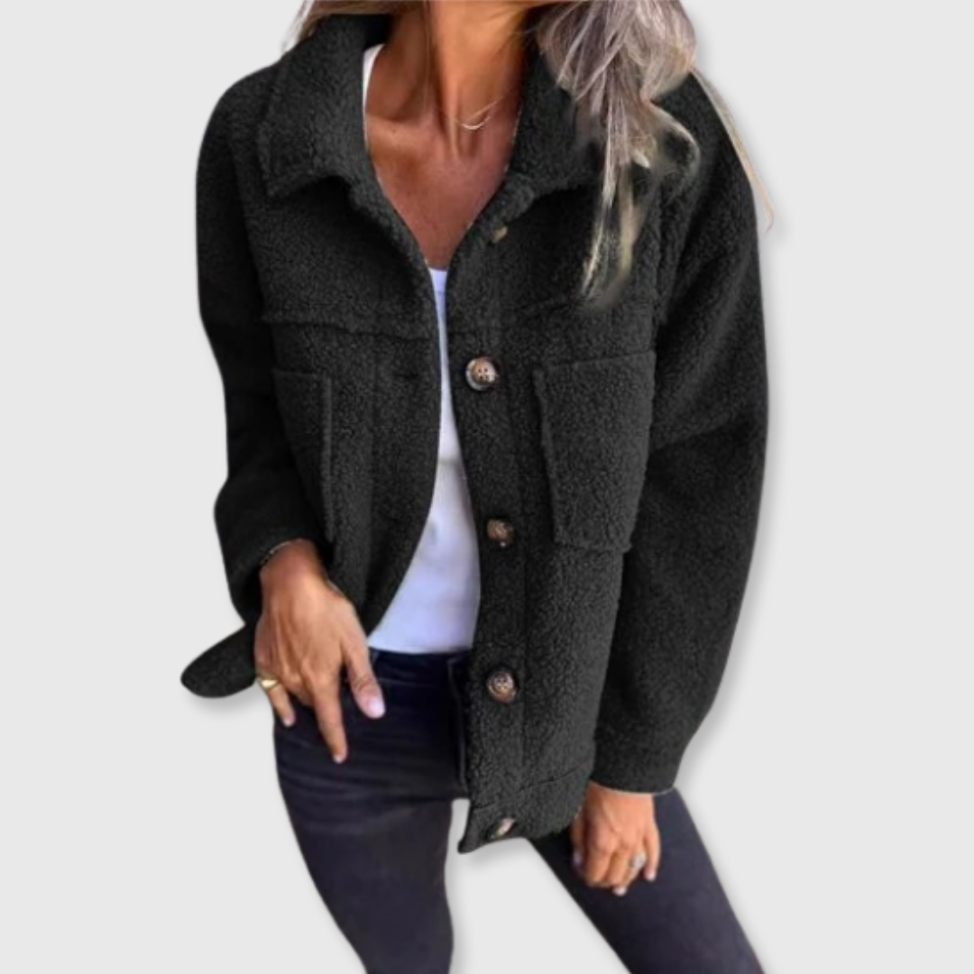 Black sherpa-style jacket with button front, spread collar, and side pockets.