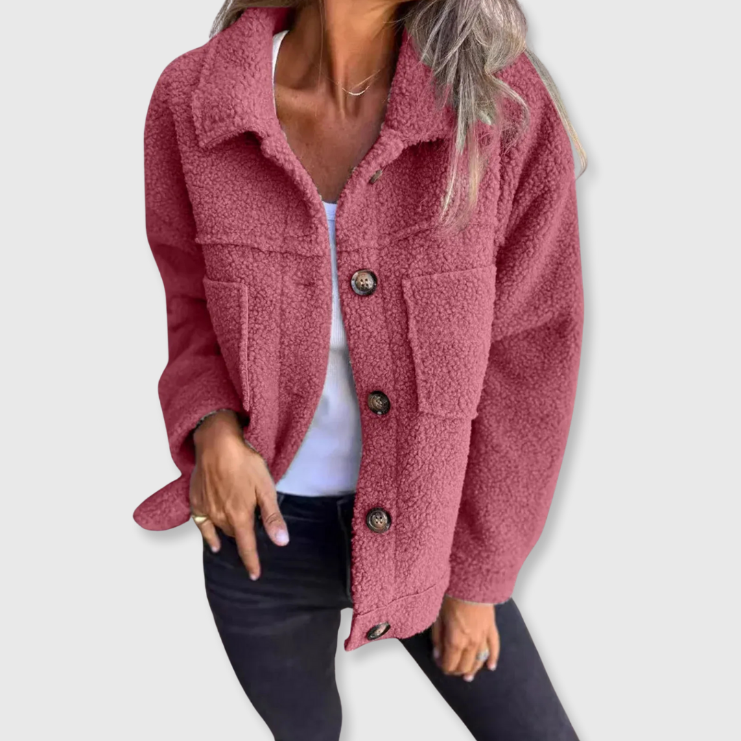 Pink sherpa-style button-front coat with flap pockets and spread collar.