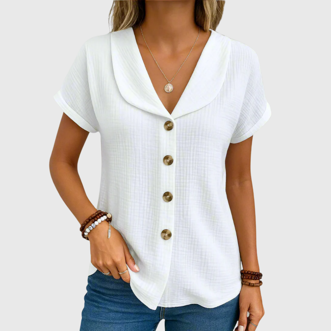 White buttoned blouse with V-neck, short sleeves, and front button placket