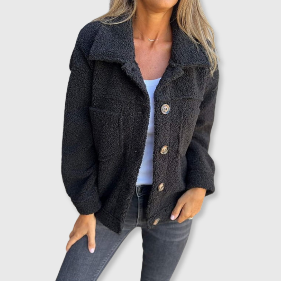 Black sherpa-style button-front coat with two flap pockets and spread collar.