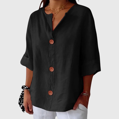 Black relaxed blouse with V-neck button front, short sleeves, loose elegant drape