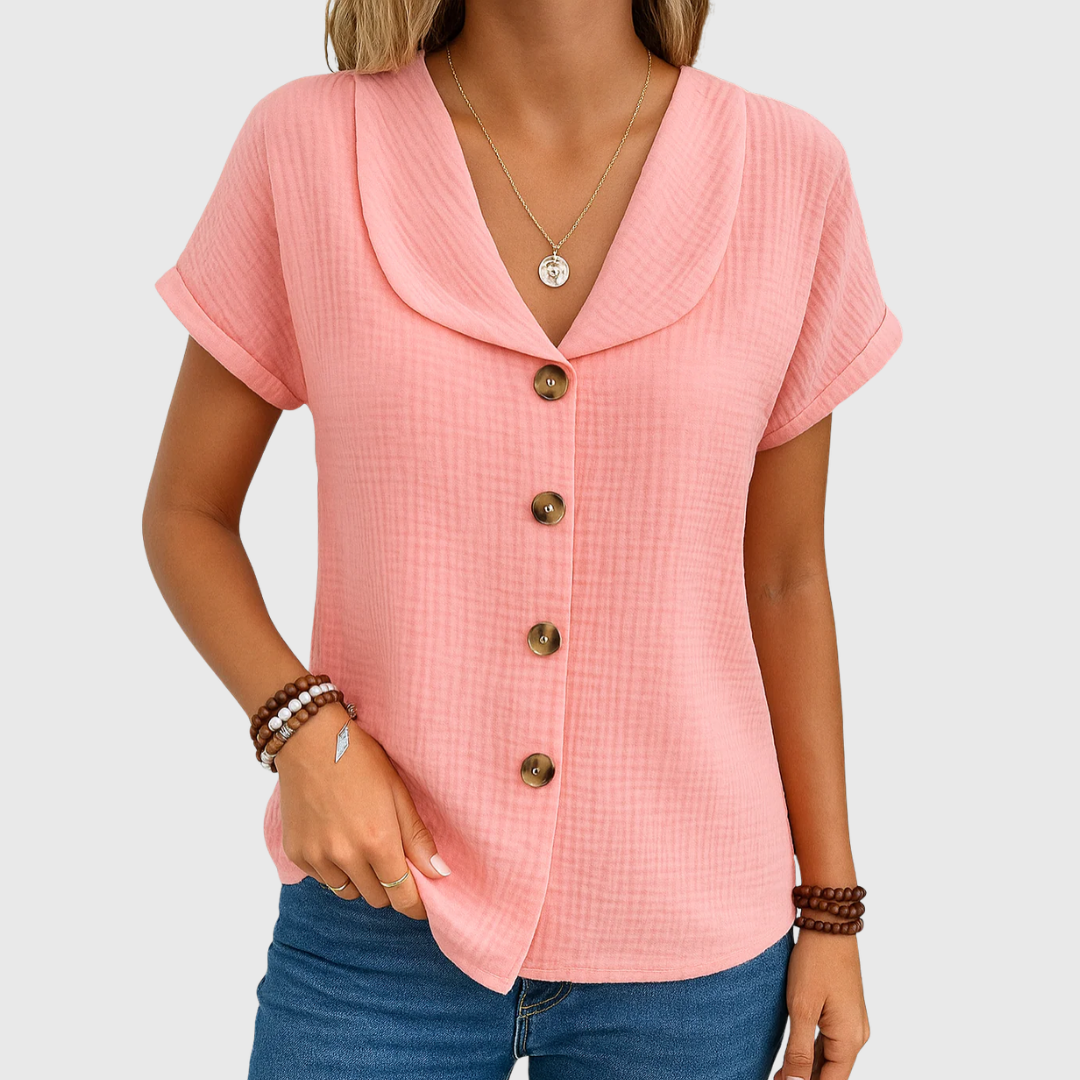 Pink buttoned blouse with V-neck, short sleeves, and bronze front buttons