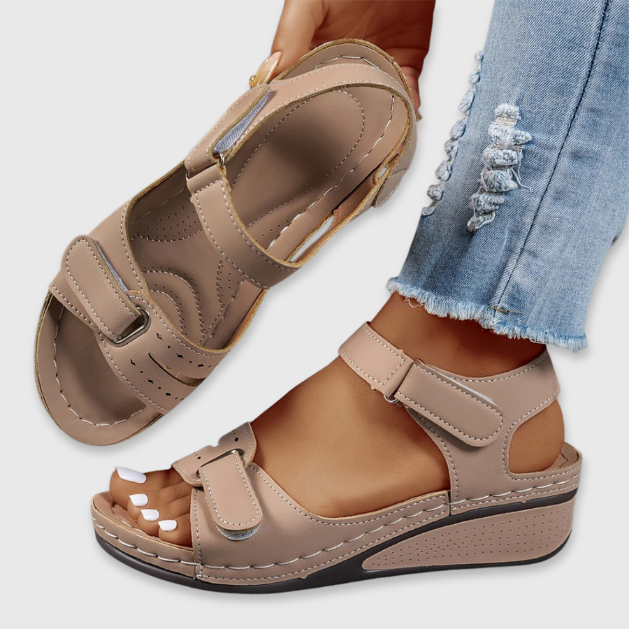 Tan leather open-toe sandals with two hook-and-loop straps and cushioned footbed