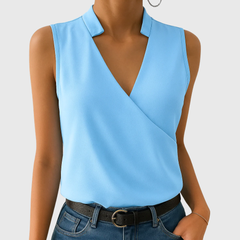 Light blue sleeveless wrap blouse with V-neck and pointed collar