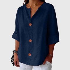 Blue relaxed blouse with V-neck and button front, short sleeves, loose fit