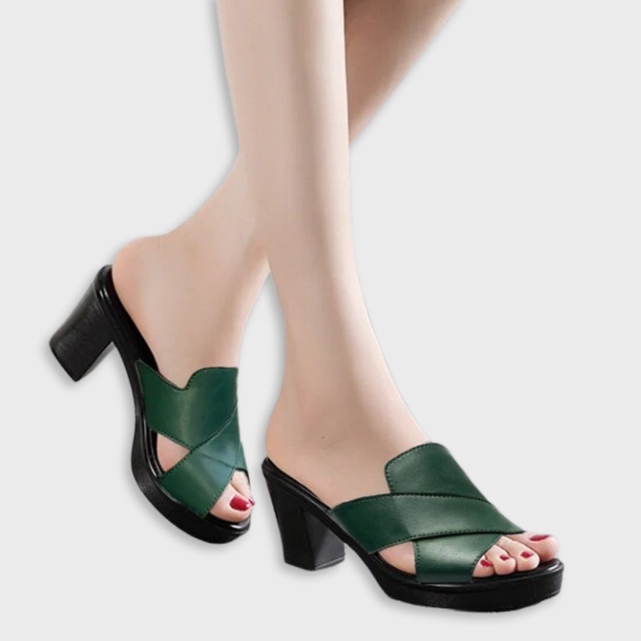 Green heeled sandals with wide crisscross straps and chunky black block heel
