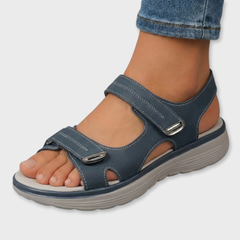 Dark blue open-toe sandals with two hook-and-loop straps and cushioned sole
