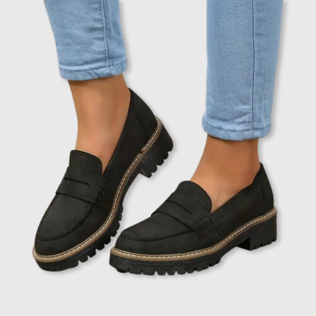 Black comfort loafers with buckle detail and chunky lug sole