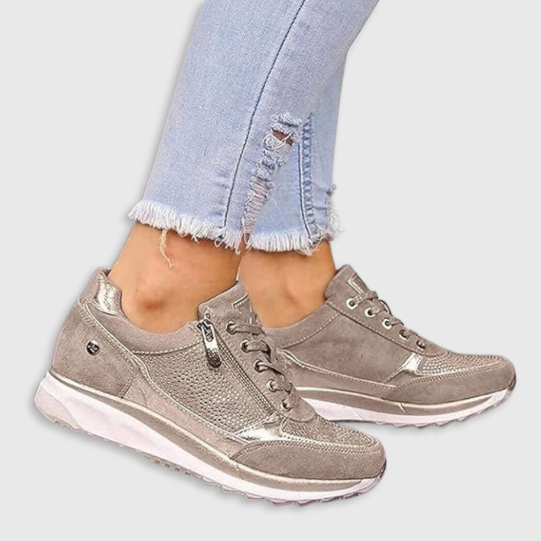 Beige metallic zip-up comfort sneakers with lace-up front and cushioned sole
