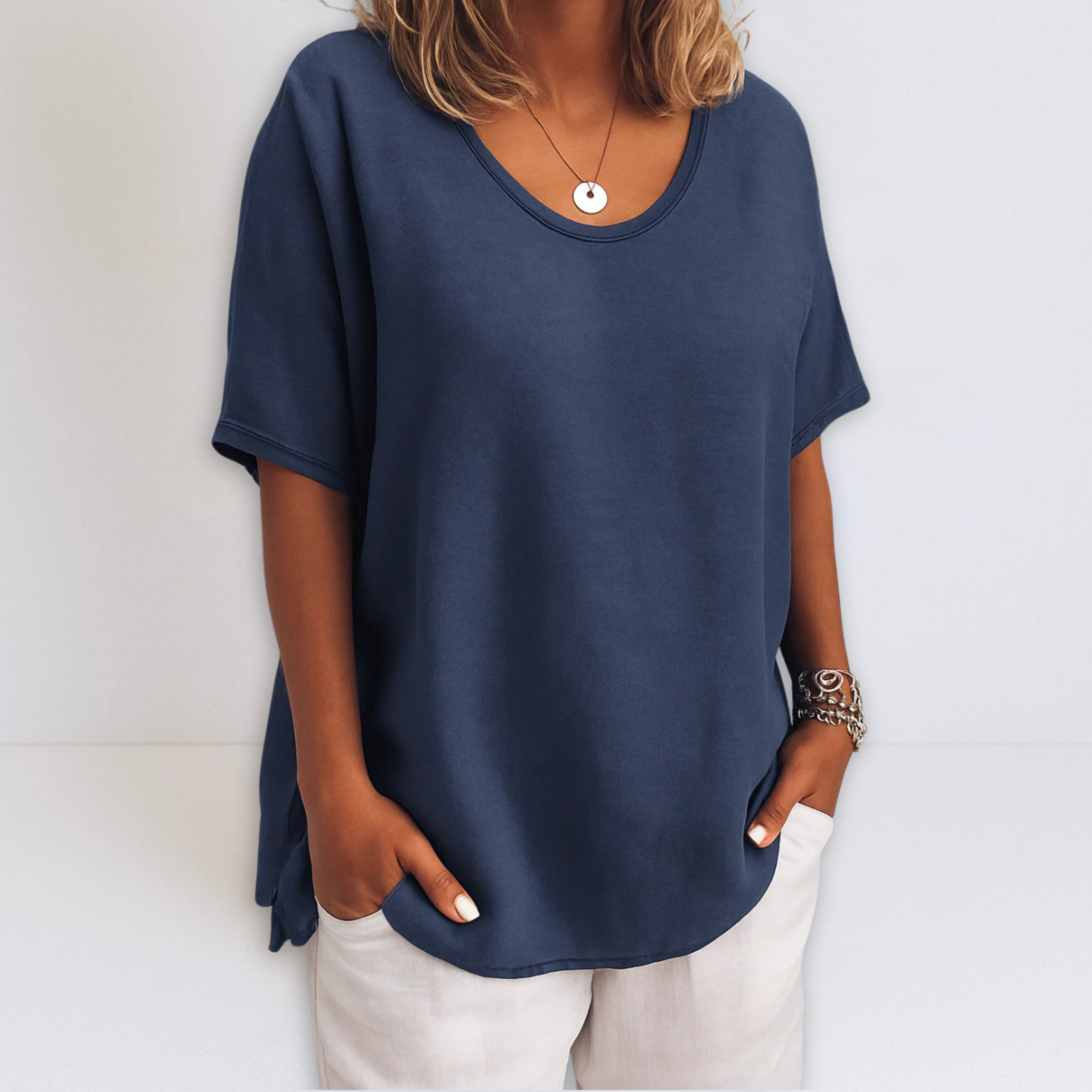 Oversized V-neck blouse in marine blue, short sleeves with loose fit and draped hem