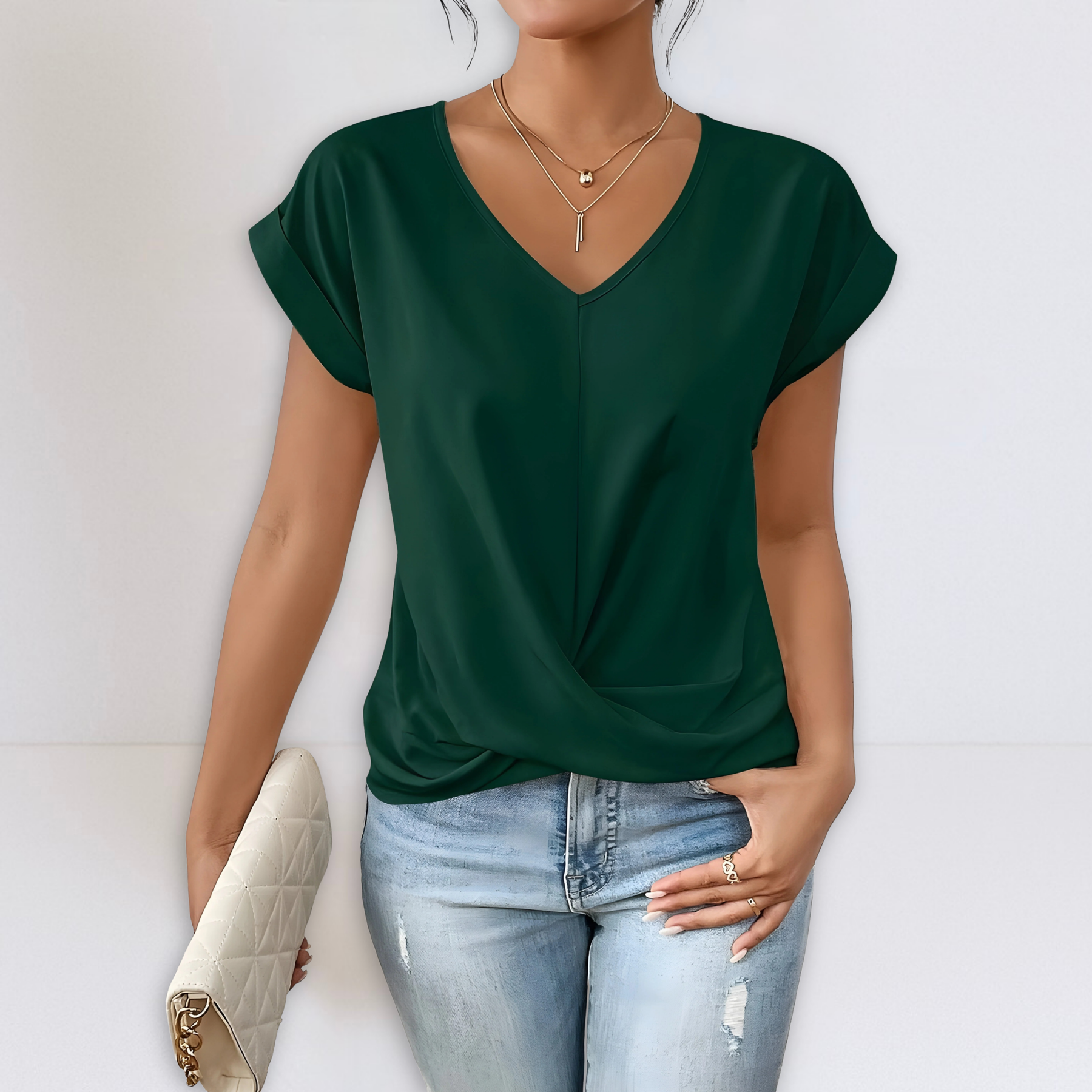 Dark green twist-front V-neck top with short sleeves and draped knot detail