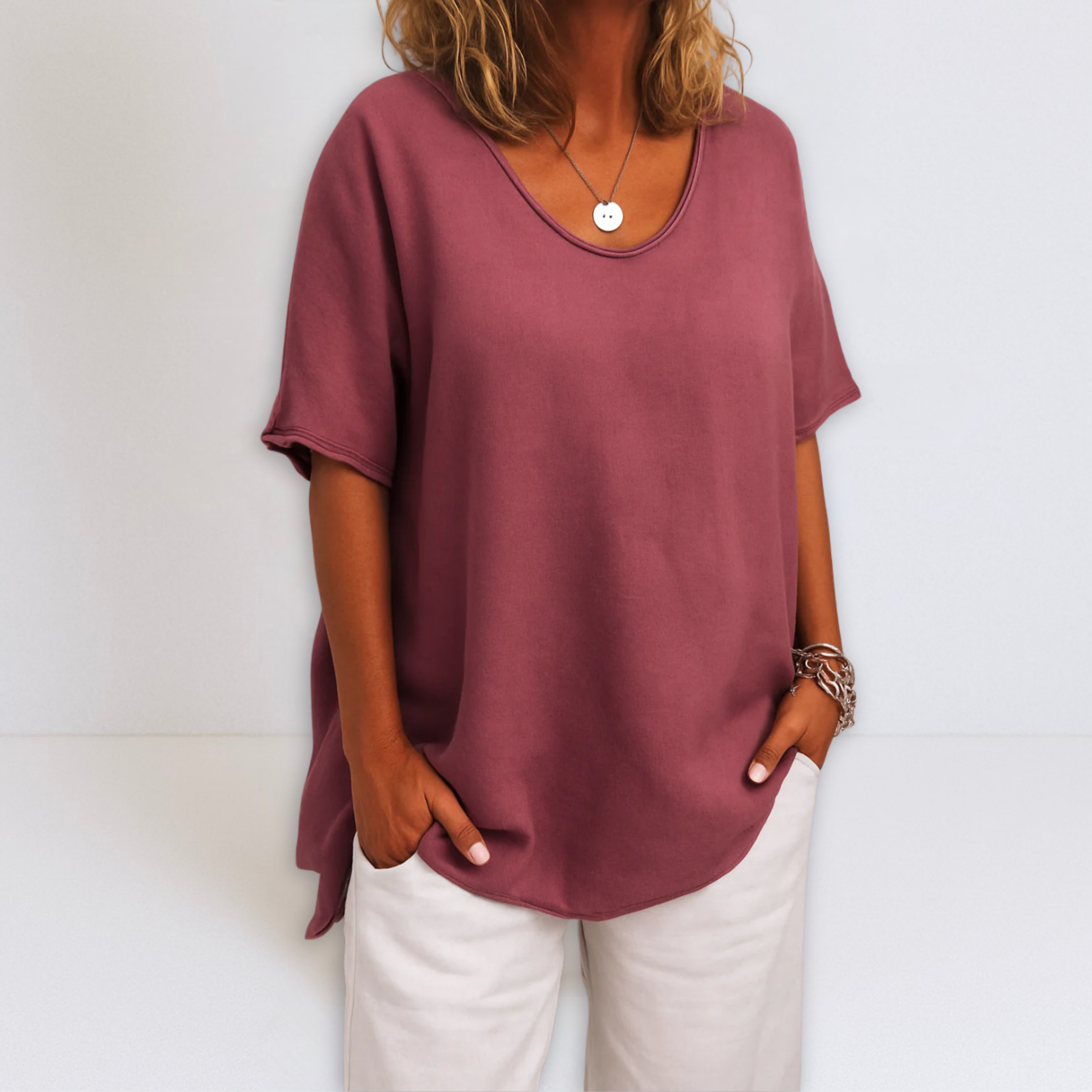 Oversized V-neck blouse in dark pink, short sleeves with loose fit and drape