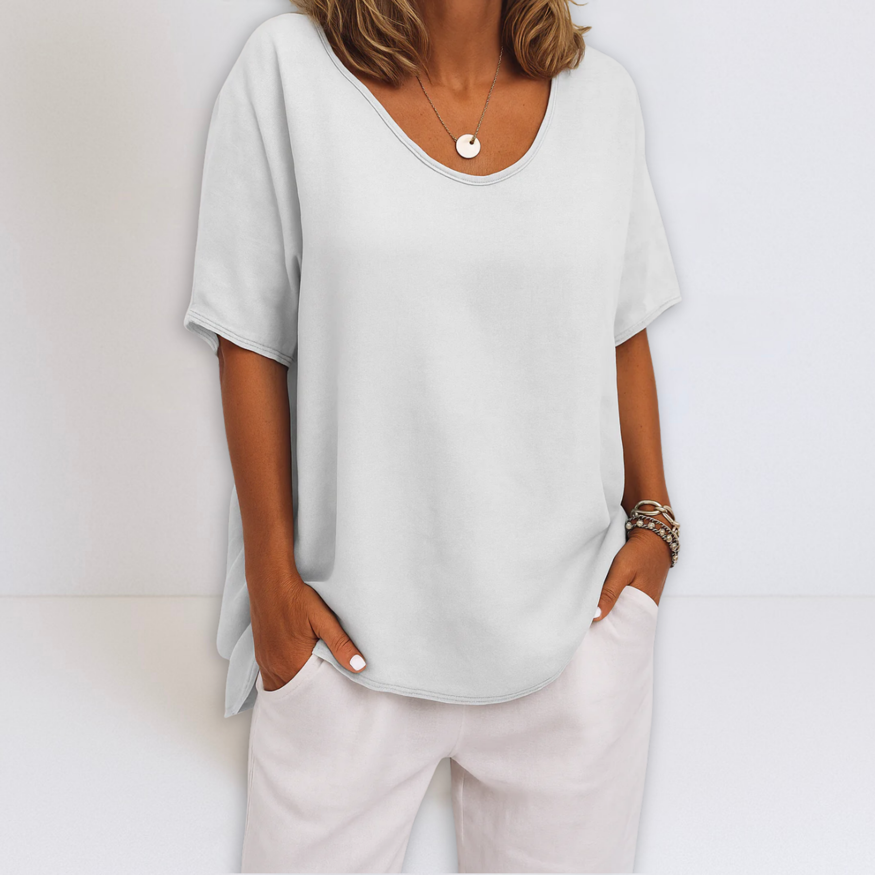 Oversized V-neck blouse in white, short sleeves and relaxed draped silhouette