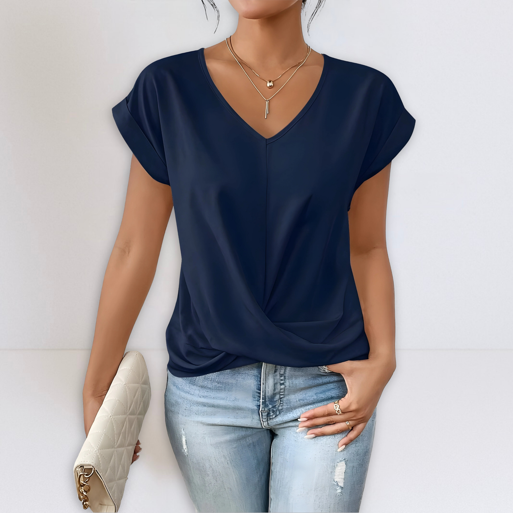 Navy twist-front V-neck top with short sleeves and draped knot detail
