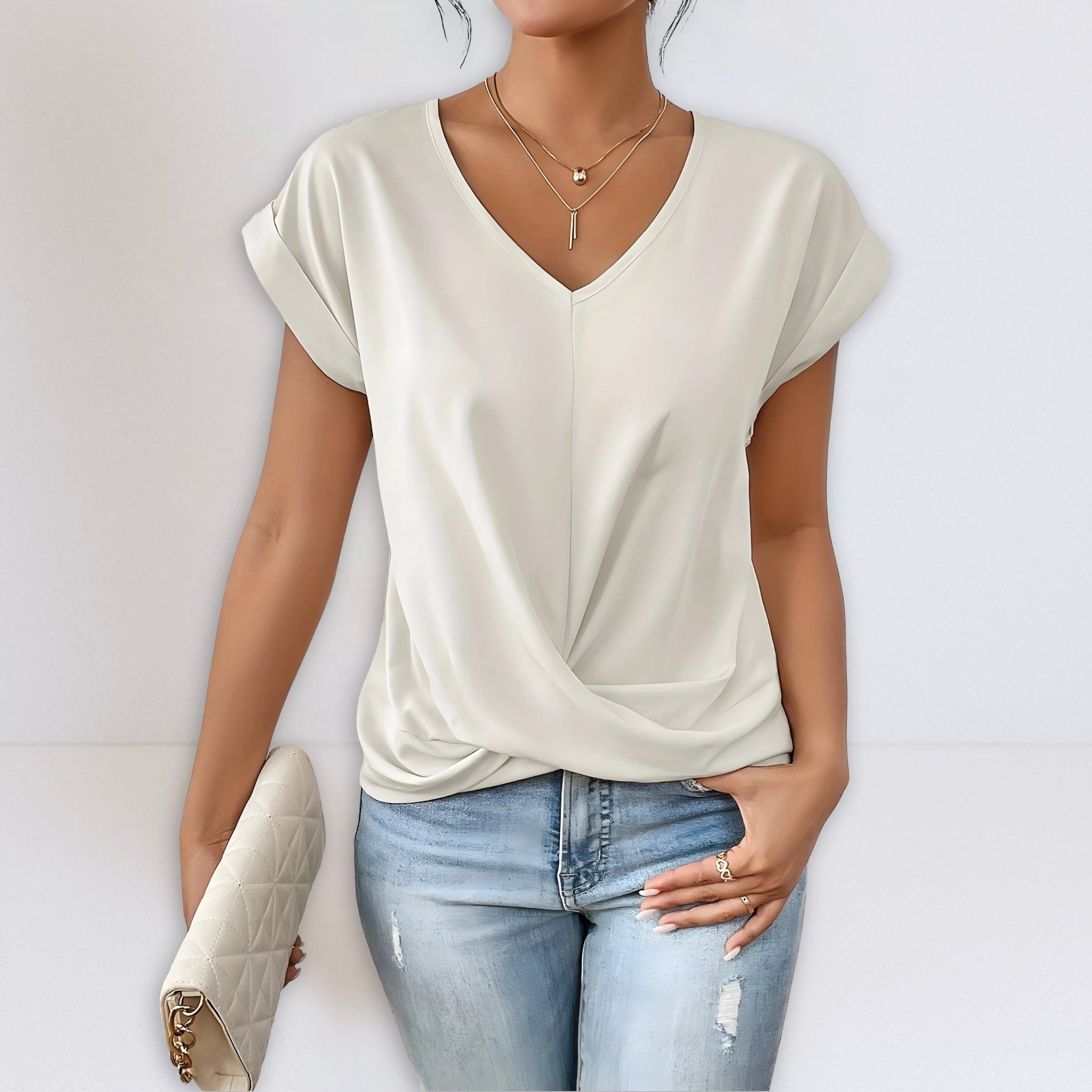 Ivory twist-front V-neck top with short sleeves and draped knot detail