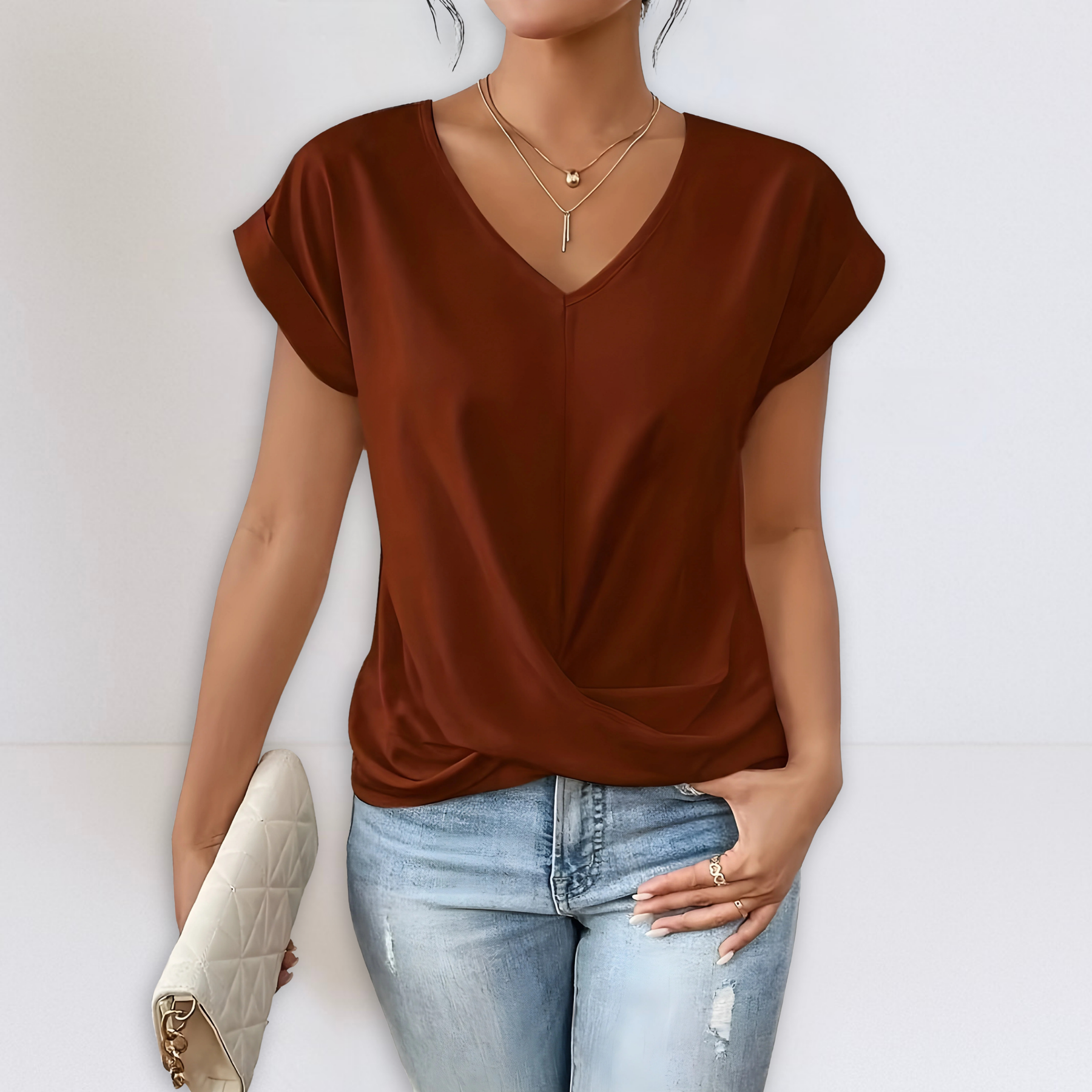 Rust brown twist-front V-neck top with short sleeves and draped knot detail