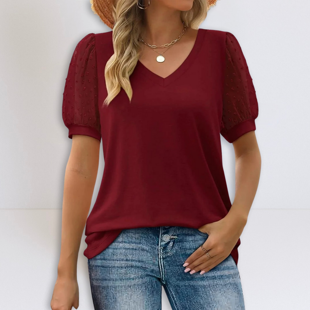 Red sheer-sleeve V-neck top with short puff sleeves and relaxed fit.