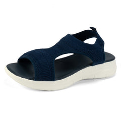 Navy blue knit slip-on sandals with open toe and white cushioned sole