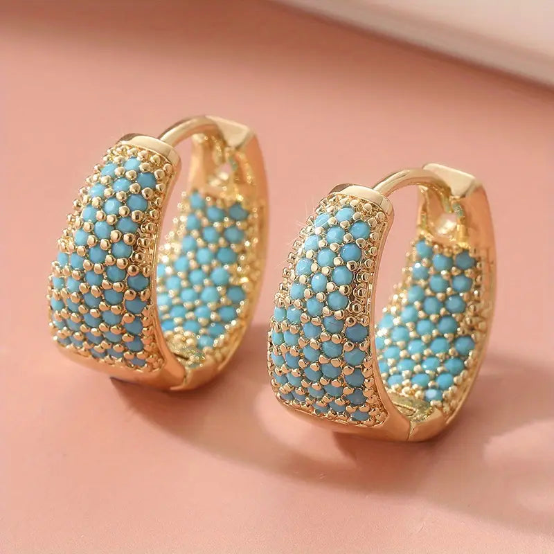 Turquoise beaded gold hoop earrings with textured lattice, two earrings shown