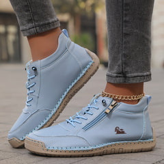 Light blue zip-up comfort shoes with lace-up laces, side zipper tab, and stitched sole