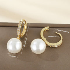 Geometric pearl drop earrings in gold with crystal detail and large faux pearls