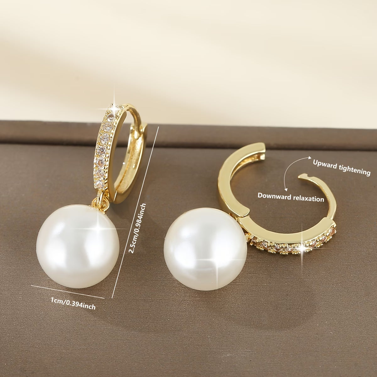 Geometric pearl drop earrings in gold with crystal detail and large faux pearls