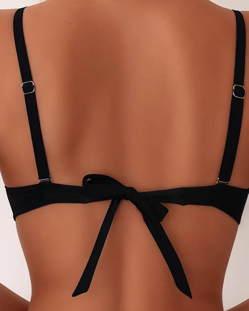 Black backless bikini set from behind with adjustable straps and bow detail