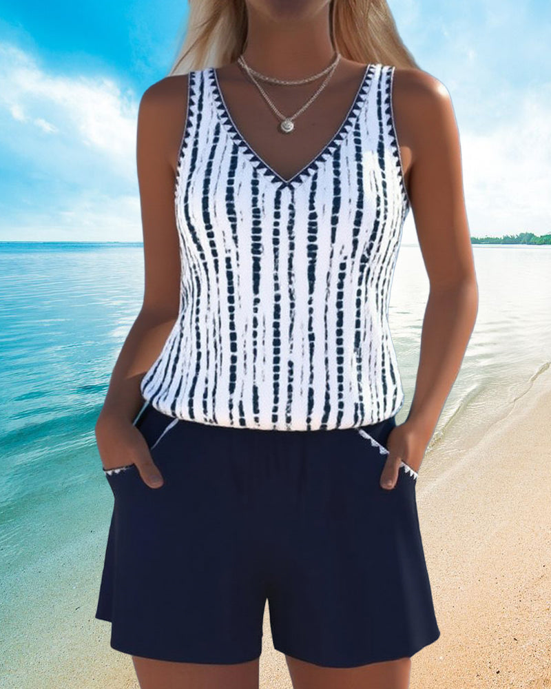 Navy two-piece V-neck swimsuit set with white vertical tie-dye stripe tank and shorts