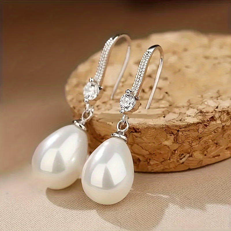 Pearl drop earrings with sparkling round tops and silver-tone hooks