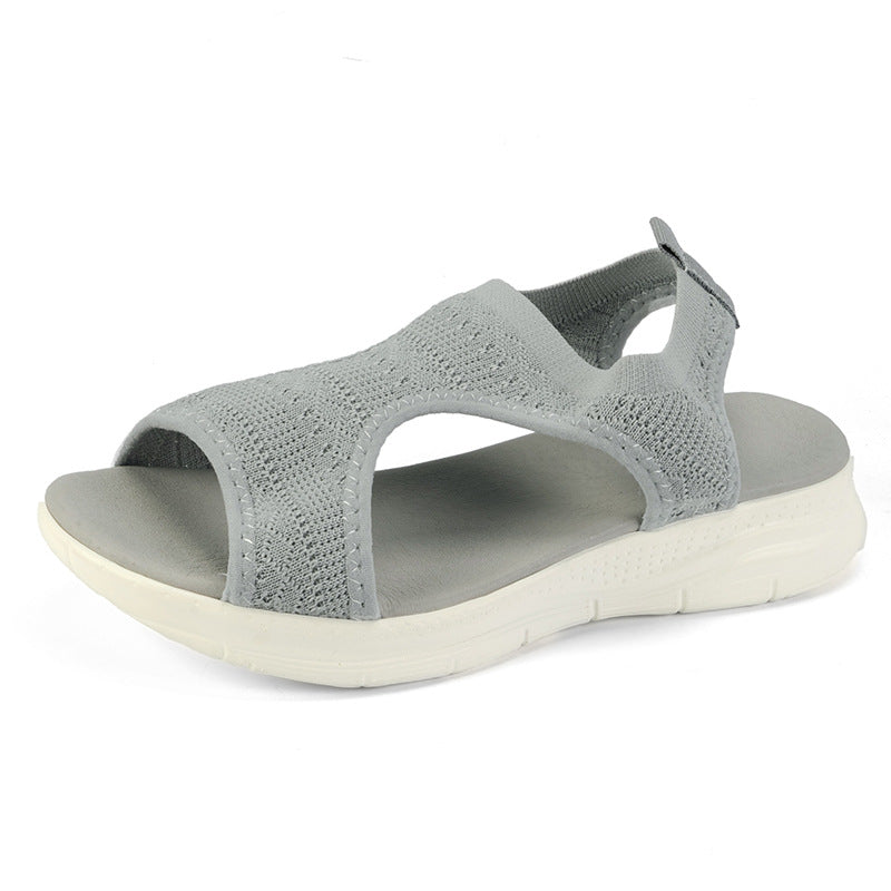 Light grey knit slide sandals with open toe and thick white cushioned sole