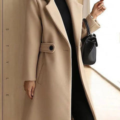 Camel beige tailored overcoat with notched lapels, front button closure, and belt