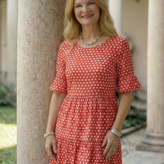 Red polka dot tiered midi dress front view with short sleeves and gathered waist