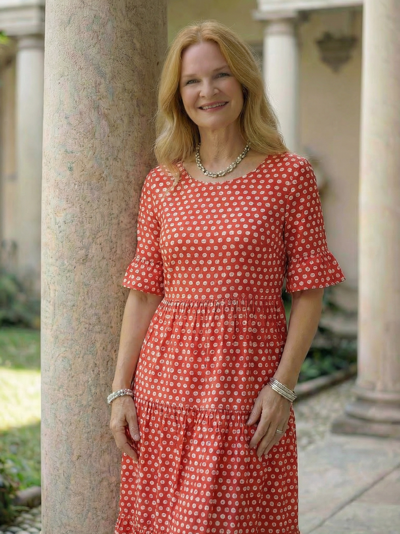 Red polka dot tiered midi dress front view with short sleeves and gathered waist