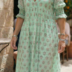 Mint green patterned midi dress with V-neck, puff sleeves and tiered skirt
