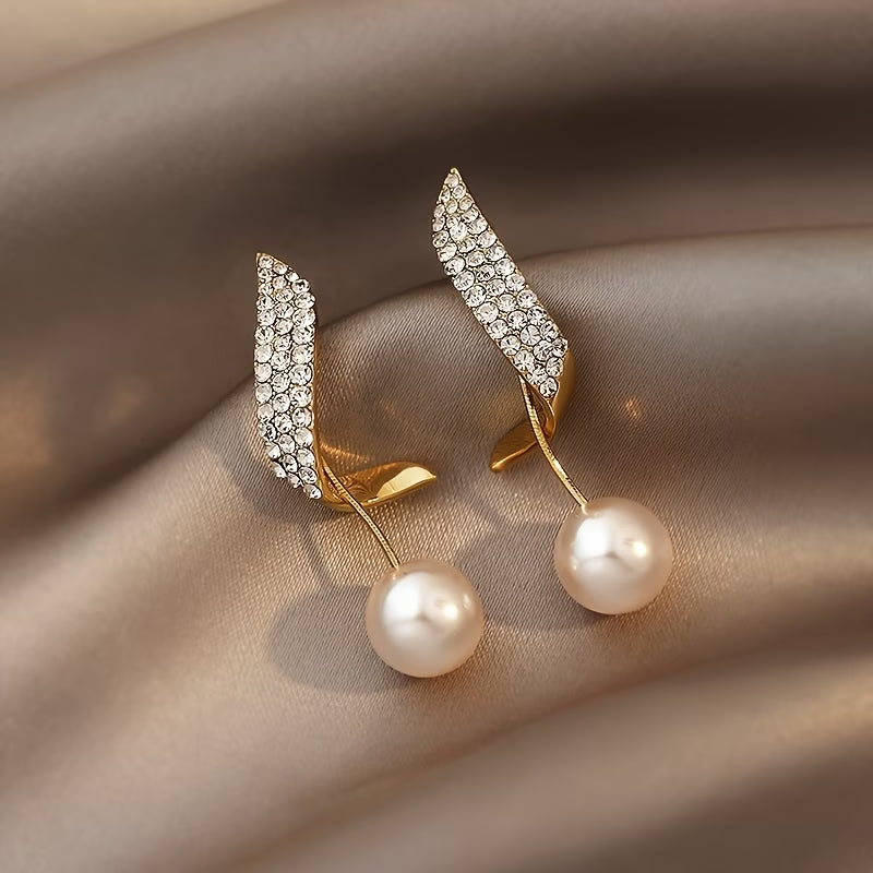 Crystal feather pearl drop earrings with pavé crystal wings