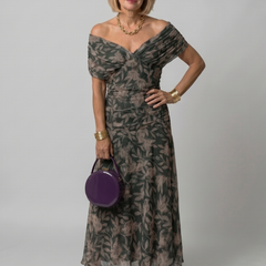 Off-shoulder maxi dress with dark green leaf print and tiered, flowing chiffon skirt
