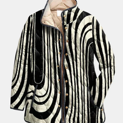 Quilted jacket with black-and-white abstract swirl stripes and tan lining, button front