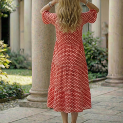 Red polka dot tiered midi dress, back view, short ruffle sleeves and round neckline