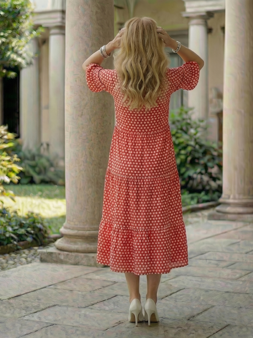 Red polka dot tiered midi dress, back view, short ruffle sleeves and round neckline