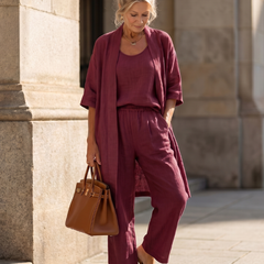 Red three-piece set with relaxed cardigan, scoop-neck top and wide-leg trousers