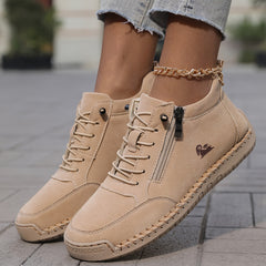 Beige zip-up comfort shoes close-up, lace-up front and side zipper detail