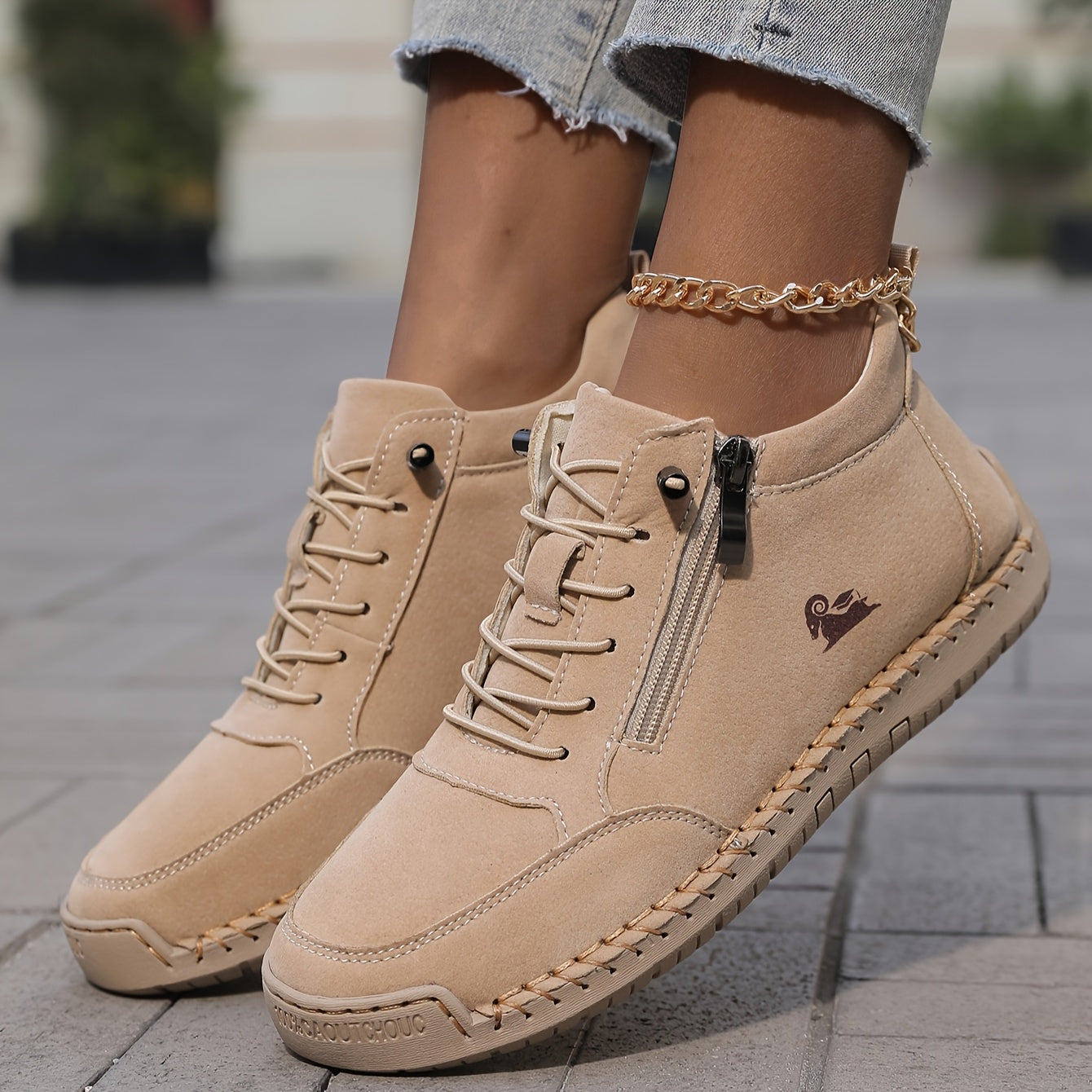 Beige zip-up comfort shoes close-up, lace-up front and side zipper detail