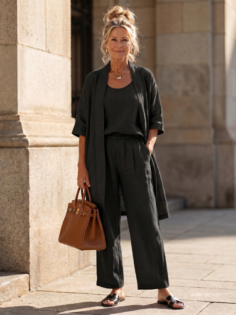Black relaxed three-piece set with open duster and wide-leg pants