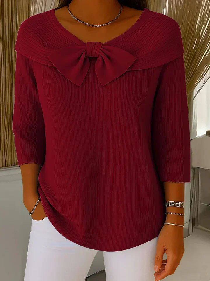 Burgundy ribbed tunic with bow neckline and three-quarter sleeves
