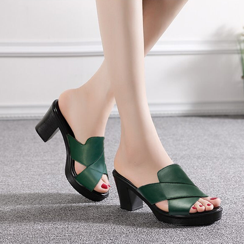 Green heeled sandals with side strap and open toe, chunky black block heel