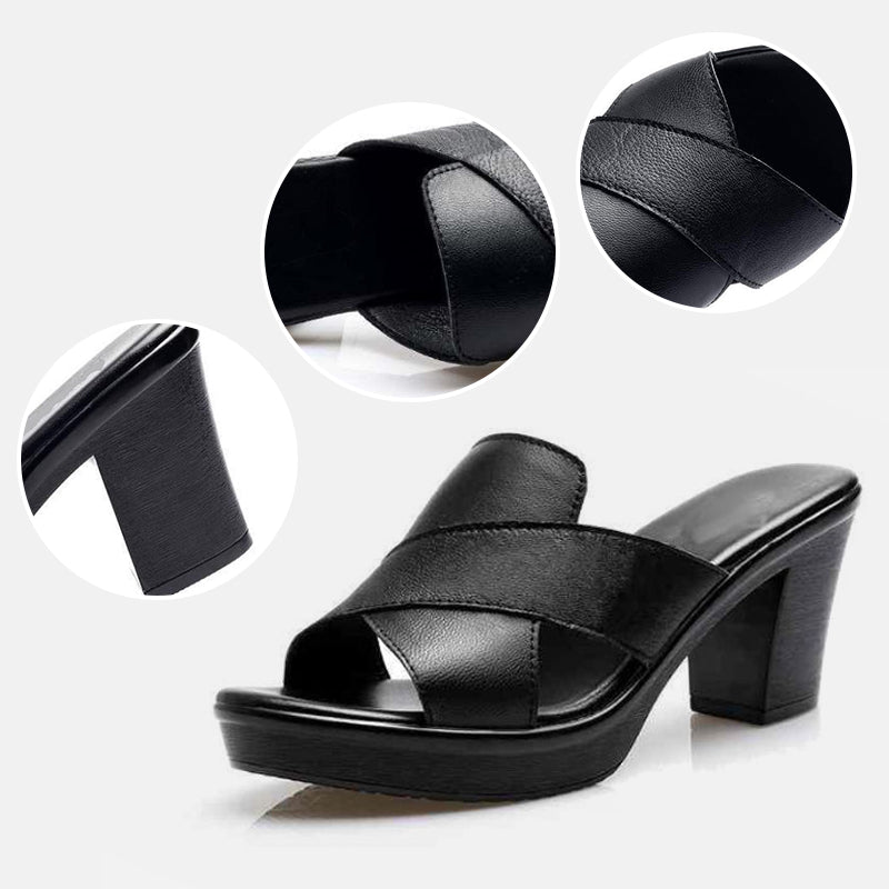 Black heeled platform sandals with wide straps and textured leather-like finish