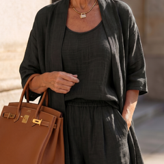 Black relaxed three-piece set with scoop-neck top, buttoned waist, and duster