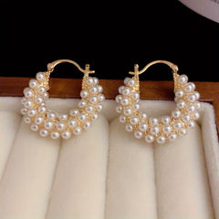 Layered pearl hoop earrings, gold-tone hoops with white pearl bead clusters