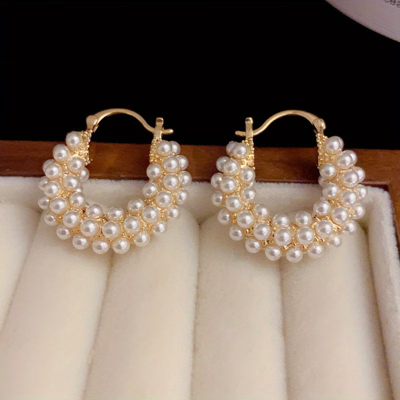 Layered pearl hoop earrings, gold-tone hoops with white pearl bead clusters